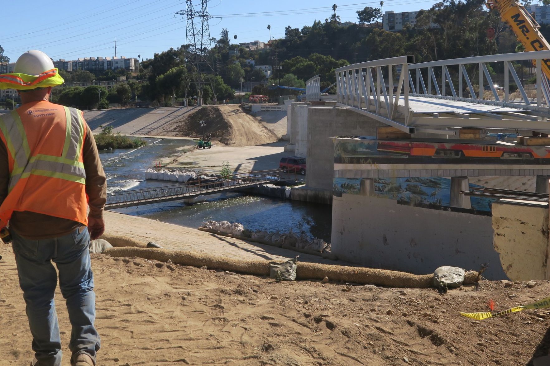 Construction worker at Red Car Pedestrian Bridge Under Construction